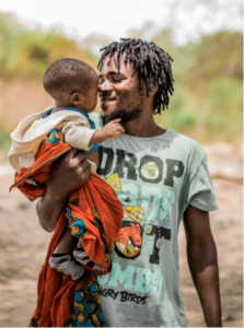 Zambisk pappa med barn